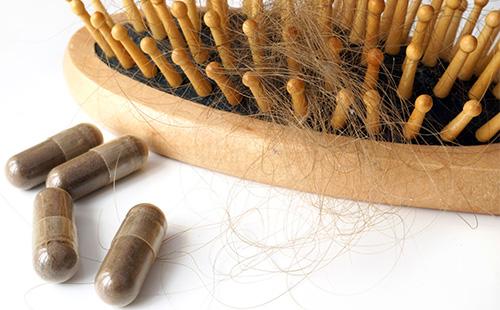 Comb with hair and pills