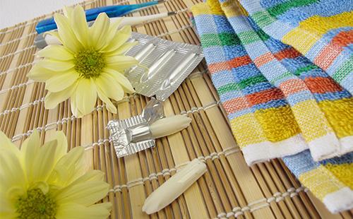 Vaginal candles near the towel