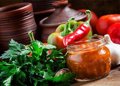 Jar with adjika and red hot pepper