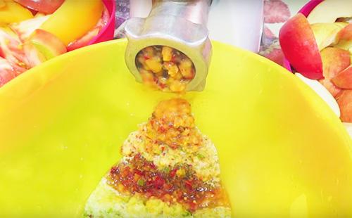 Grinding on a meat grinder ingredients for adjika