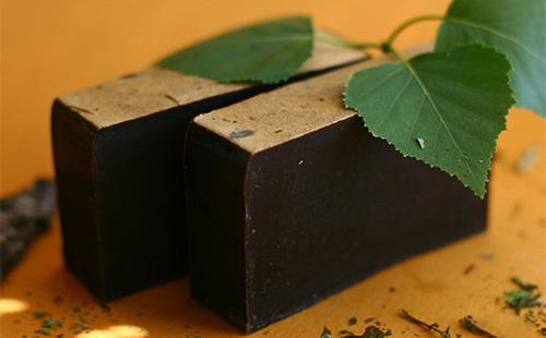 Two pieces of tar soap