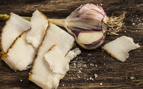 Slices of fat and head of garlic