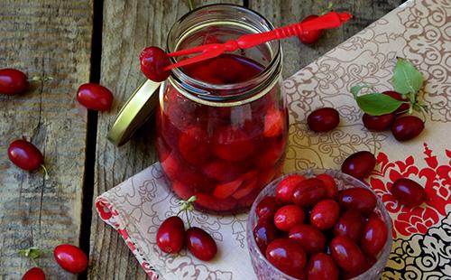 Dogwood compote in a jar on the table