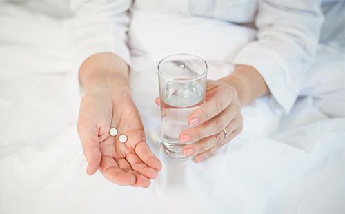 Pills in a woman's hand