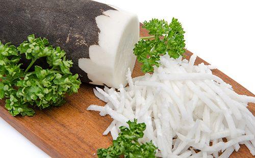 Grated black radish on the board