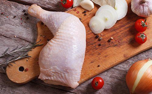Chicken Leg on a Cutting Board