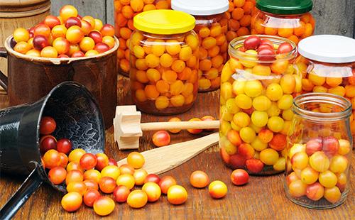 Ripe yellow cherry plum on the table