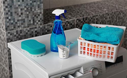 Detergent and towel on the washing machine