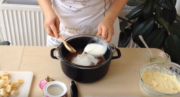 Combine cocoa with sugar and milk.