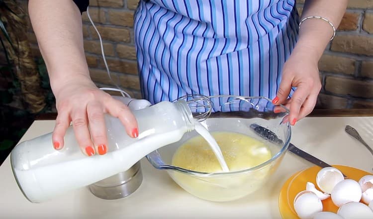 Add milk to the eggs and beat again.