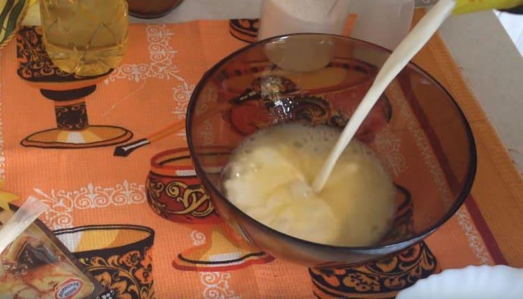 Beat the eggs and add milk to them.