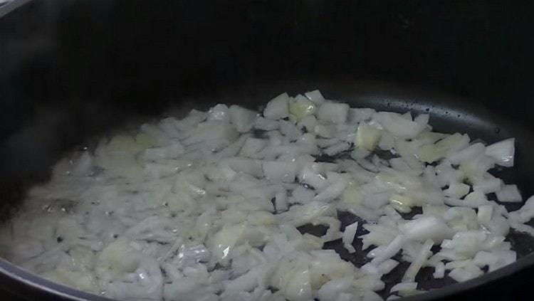 Fry finely chopped onions in a pan.
