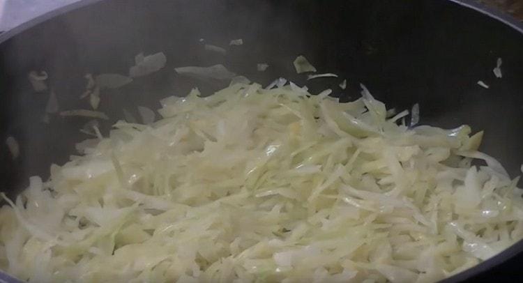 The cabbage filling for pancakes is usually cooked in a pan.