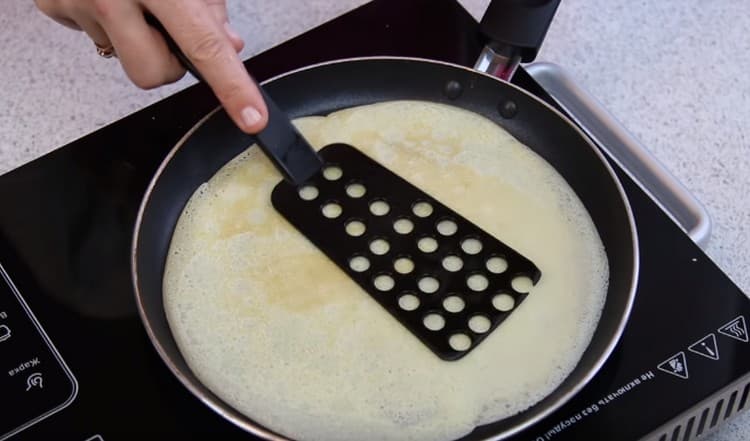 Turn the pancake on the other side.