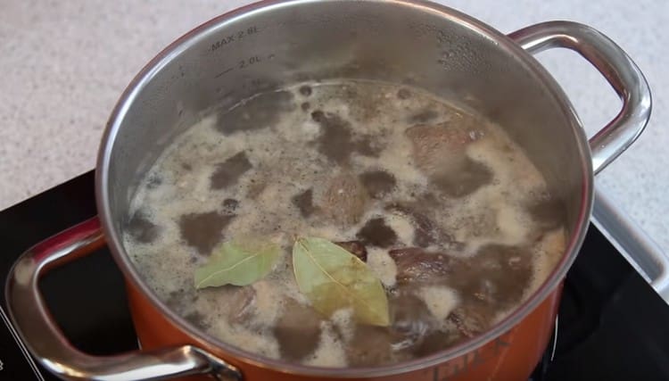 Add pepper, bay leaf and cook meat until tender.