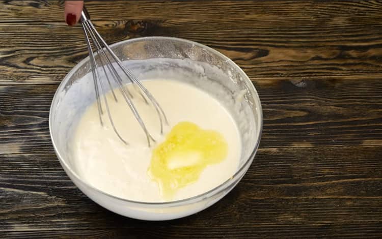 Add melted butter to the dough.