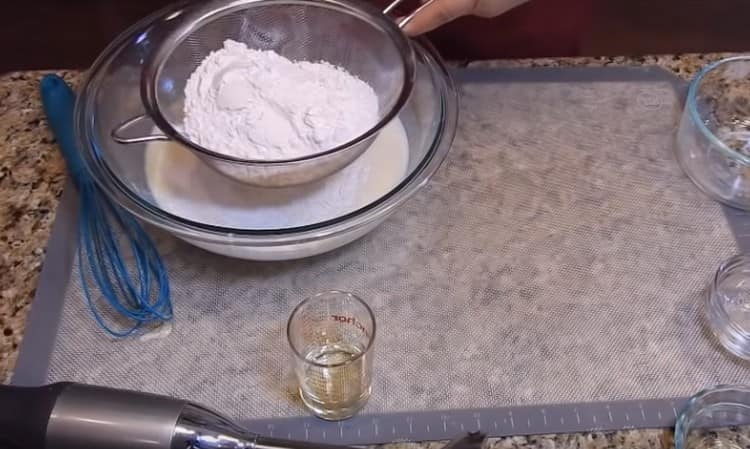 Sift flour into the dough.
