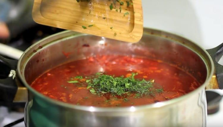 At the end, salt the dish, add bay leaf and chopped greens.