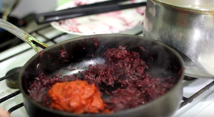 Next, add tomato paste to beets.