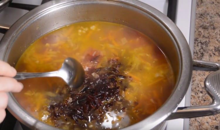 Grate pre-cooked beets and add it to an almost finished borsch.