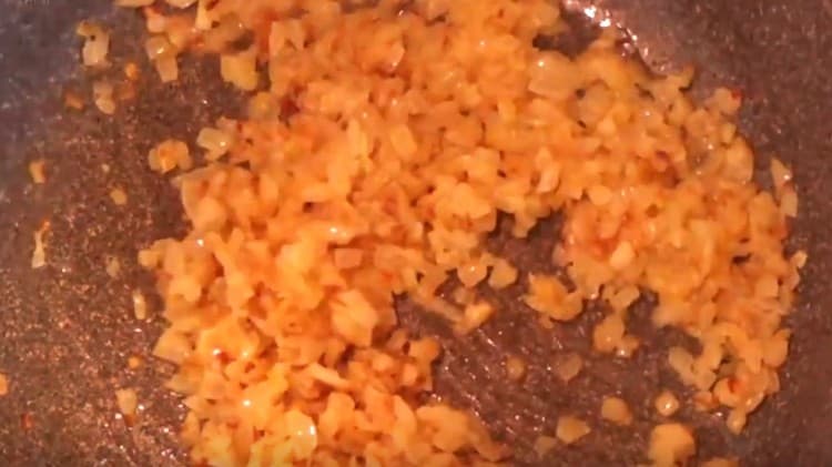 Fry the onion until golden brown.