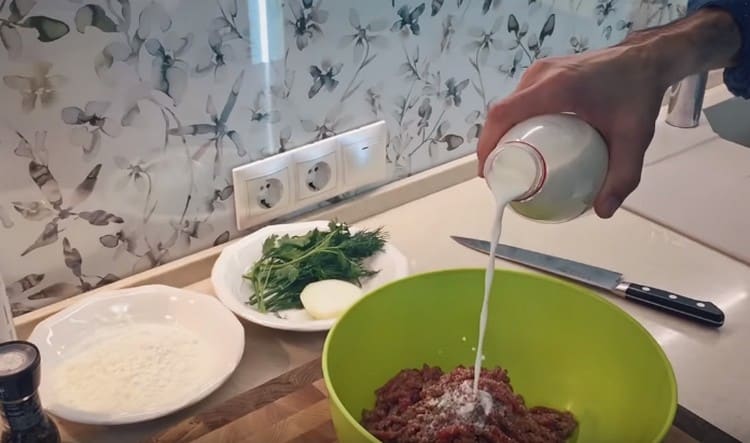 Add salt, pepper, and milk to the minced meat.