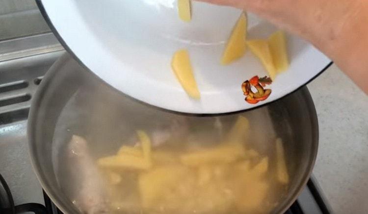 Add potatoes to the broth.