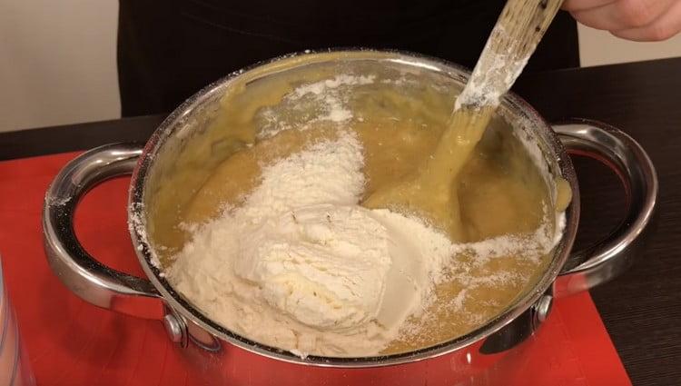 Then remove the pan from the stove and add the flour.