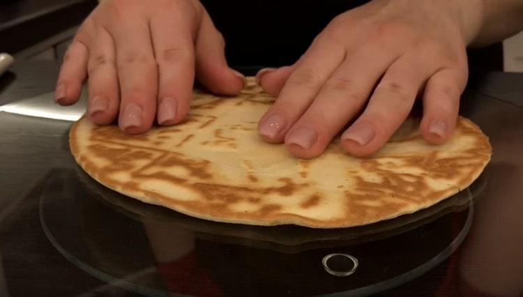 Put the first cake on the cream.