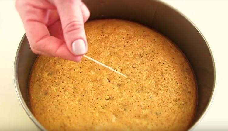 The readiness of the cakes is checked with a toothpick.