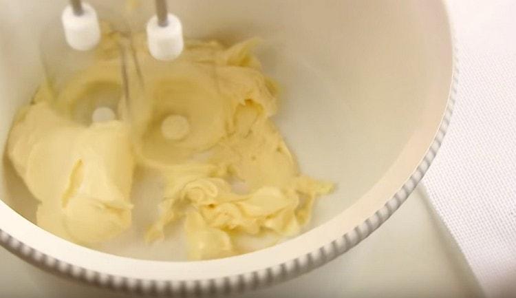 Beat softened butter with a mixer.