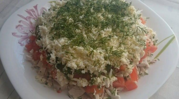 Top decorate salad with boiled chicken finely chopped dill.