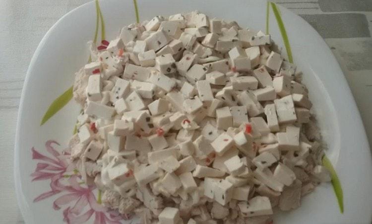 put a layer of cheese on the chicken.