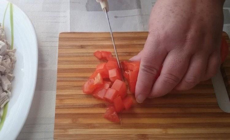 cut fresh tomato in the same cube.