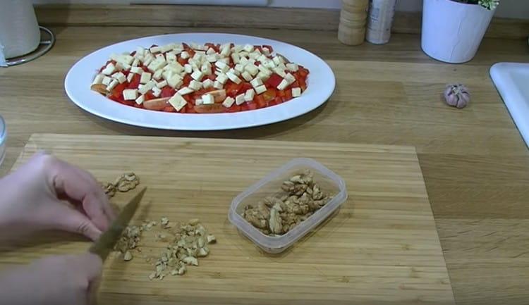 Grind walnuts with a knife or blender.