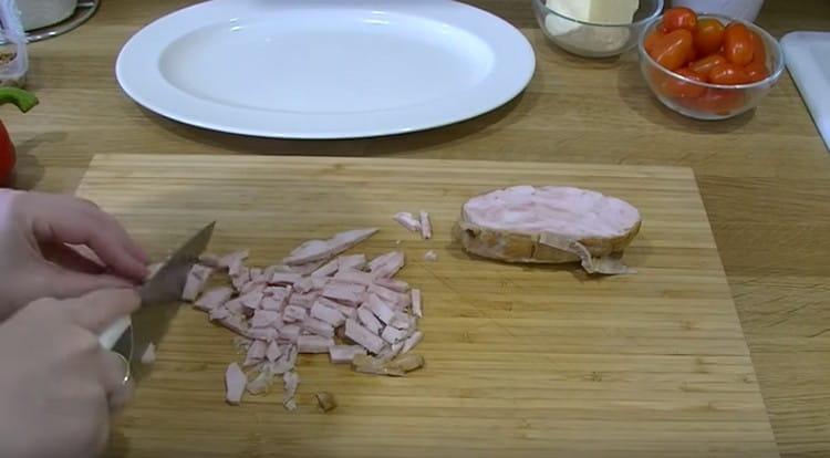 Cut the smoked chicken into pieces.