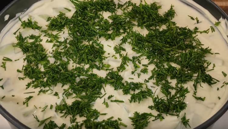 Decorate the top of the salad with finely chopped greens.