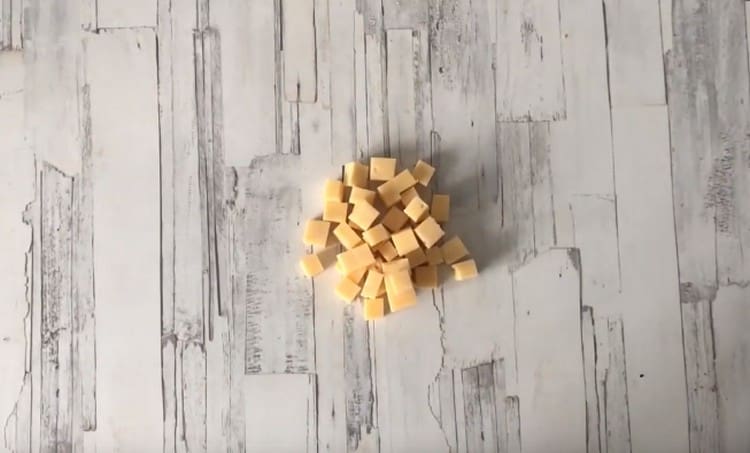 Hard cheese cut into cubes.
