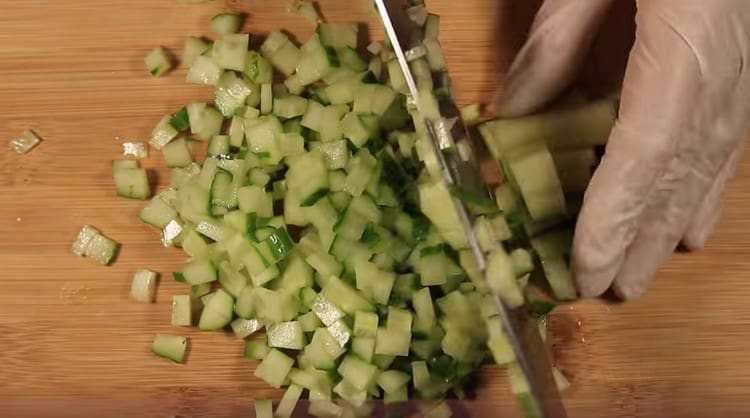 Cut a small cube of fresh cucumber.