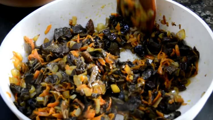 Add mushrooms to the roast, simmer all together.