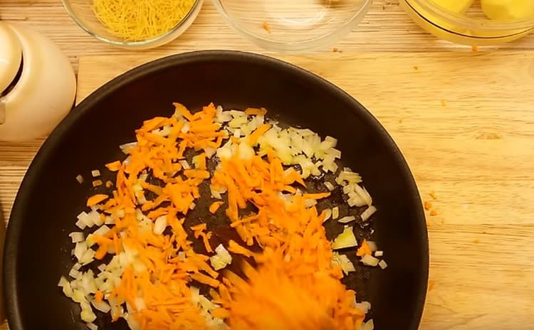 Cooking onions and carrots.