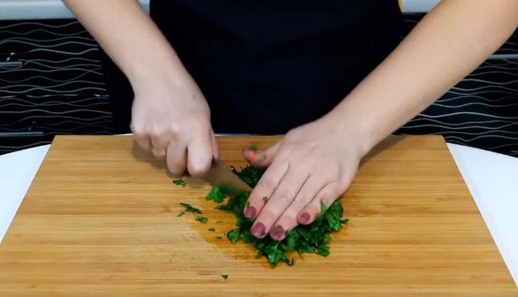 Grind the cilantro with a knife.
