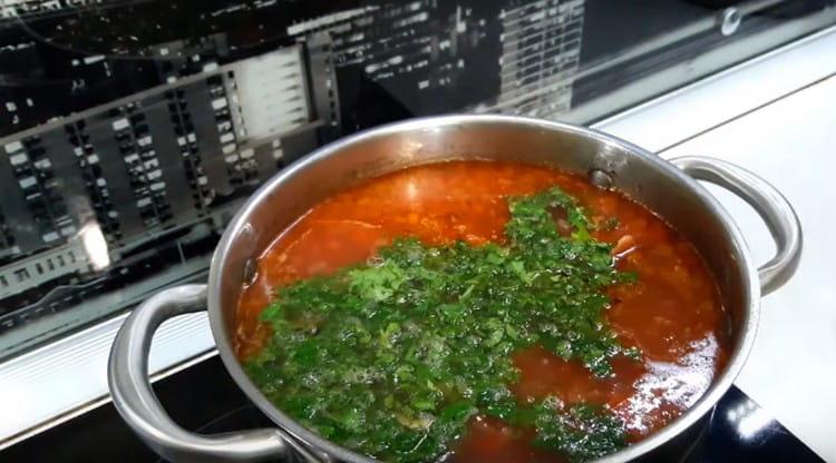 Ready soup seasoned with cilantro with garlic.