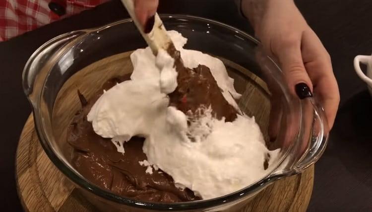 In parts, we introduce whipped proteins into the chocolate blank.