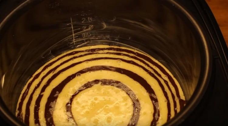 Alternate white and chocolate dough until it ends.