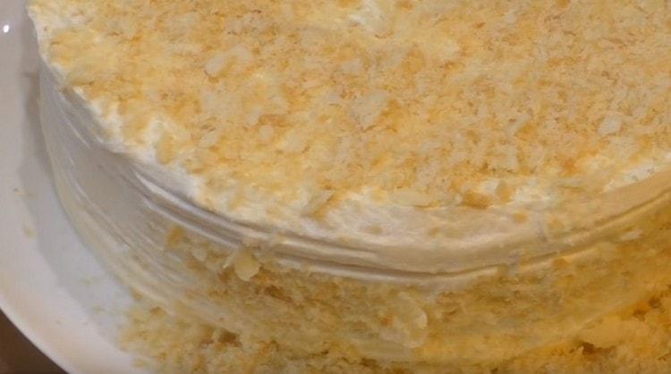 Sprinkle almost finished cake with crumbs.