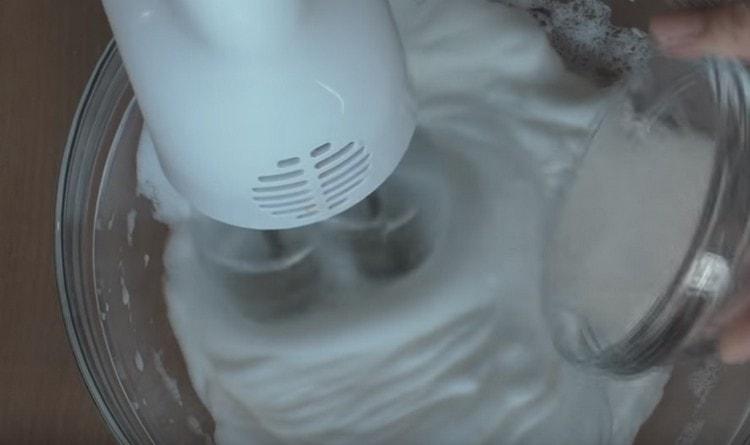 Beat the whites separately, adding sugar.