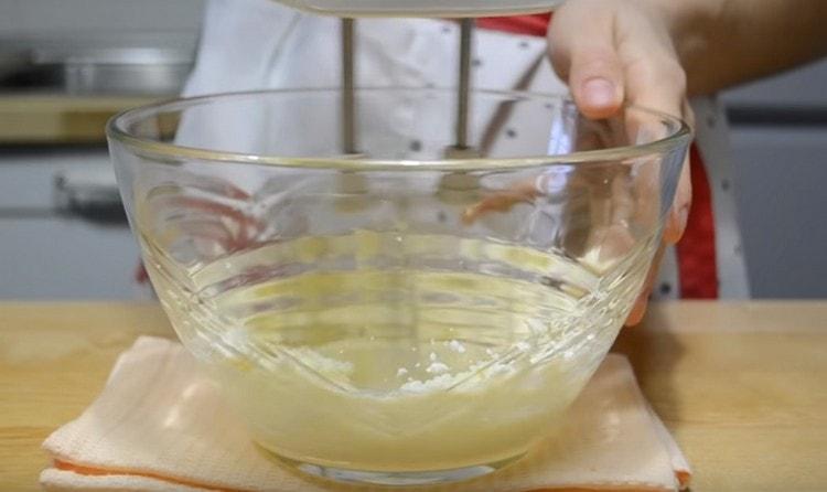 Beat butter with a mixer.