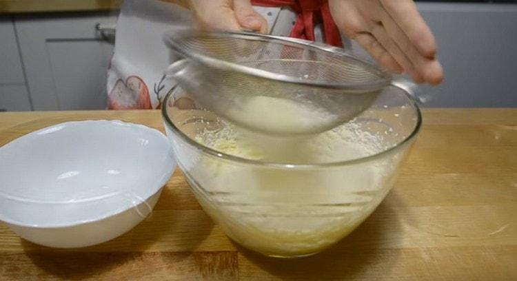 Sift the flour mixed with baking powder into this mass.