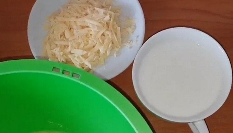 On a coarse grater, three hard cheese.